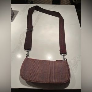 Red plaid baguette bag with guitar strap. Urban outfitter bag!